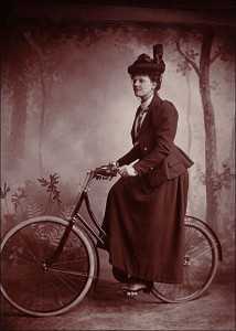 Photographer unknown, A lady wearing “proper attire” astride her bicycle, Circa 1898. Cabinet card, Collection of Lorne Shields.