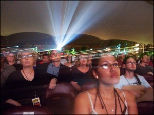 Festival-goers watch the evening presentations in the Pavilion. Courtesy, © Susan Katz 2009