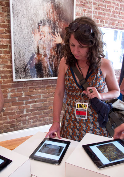 Viewers can learn more about photographers work and visit with other Festival-goers in the process. Courtesy, © Susan Katz 2011