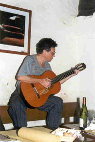 A. D. Coleman strumming a guitar. © 2000 by A. D. Coleman. All rights reserved.